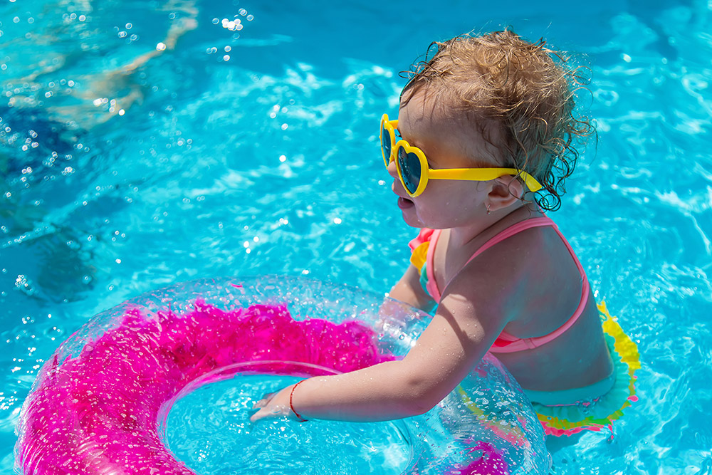 toddler swimming on vacation